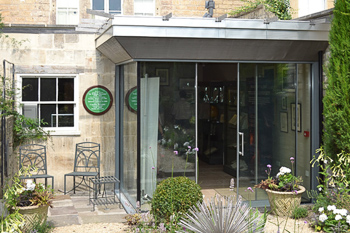View from the garden of the modern glass extension to the Herschel Museum in Bath