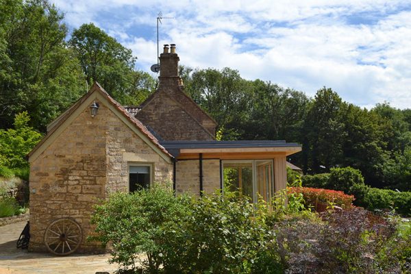 Image showing garden room extension in foreground and original cottage beyond