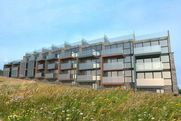 Image showing the cliff side exterior of the contemporary development designed by Hetreed Ross. The images shows how the low maintenance materials such as zinc, natural stone and acetylated timber create a harmony between the scheme and the surrounding environment.