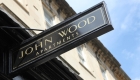 Photograph of the 'john wood apartments' sign.