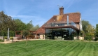 Copper and glass extension to grade 2 listed kent farmhouse