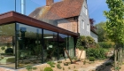 Copper and glass extension to grade 2 listed kent farmhouse