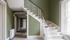 Image of a beautiful staircase and hallway with large window
