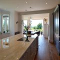 New kitchen and dining room extension beyond with view to garden