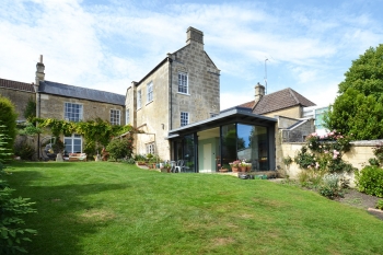 View from garden of contemporary extension and listed Georgian house