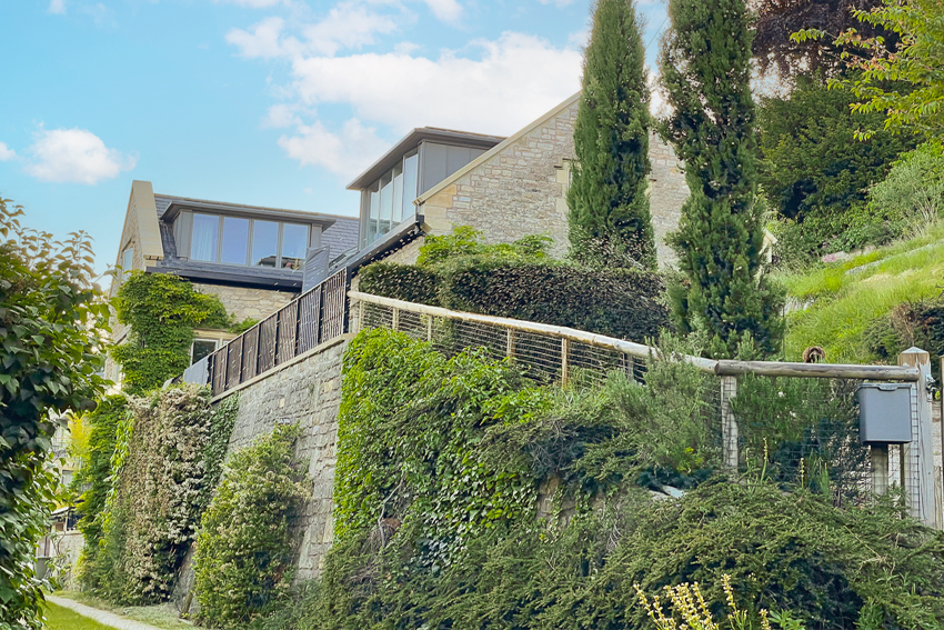 External view looking up at house from below