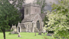 image of historic Church of St John the Baptist in Peasedown St John near Bath in beautiful graveyard setting