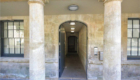 external entrance view with stone columns
