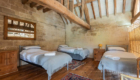 Jamies Farm listed farmhouse image with bedroom in loft space with oak roof structure exposed