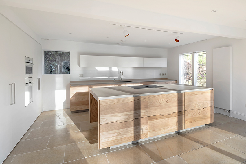 view of Ben Argent kitchen in enlarged room with more daylight improving dark 1960s house